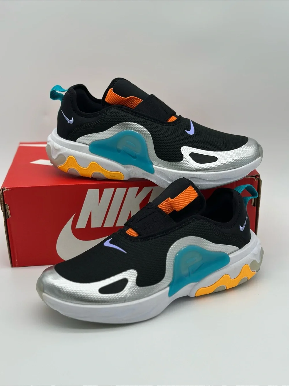 Nike Kids Black Silver Slip-On Sneakers with Orange, Teal & Yellow Accents